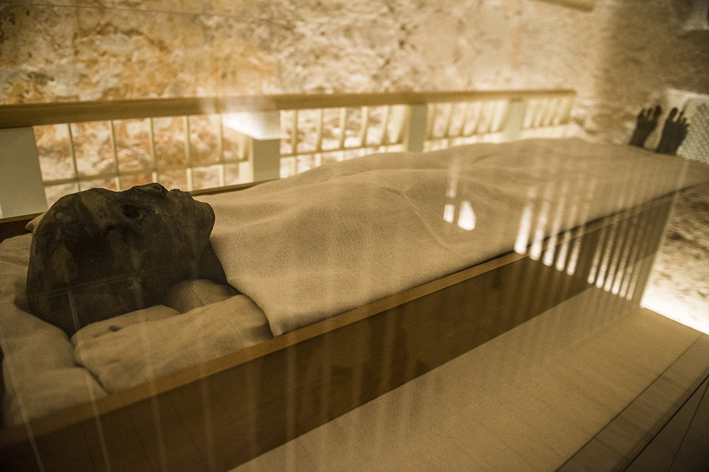 This file picture shows the linen-wrapped mummy of King Tutankhamun displayed in his climate-controlled glass case in his underground tomb KV62 in the Valley of the Kings on the West Bank of the Nile river off of Egypt's southern city of Luxor.