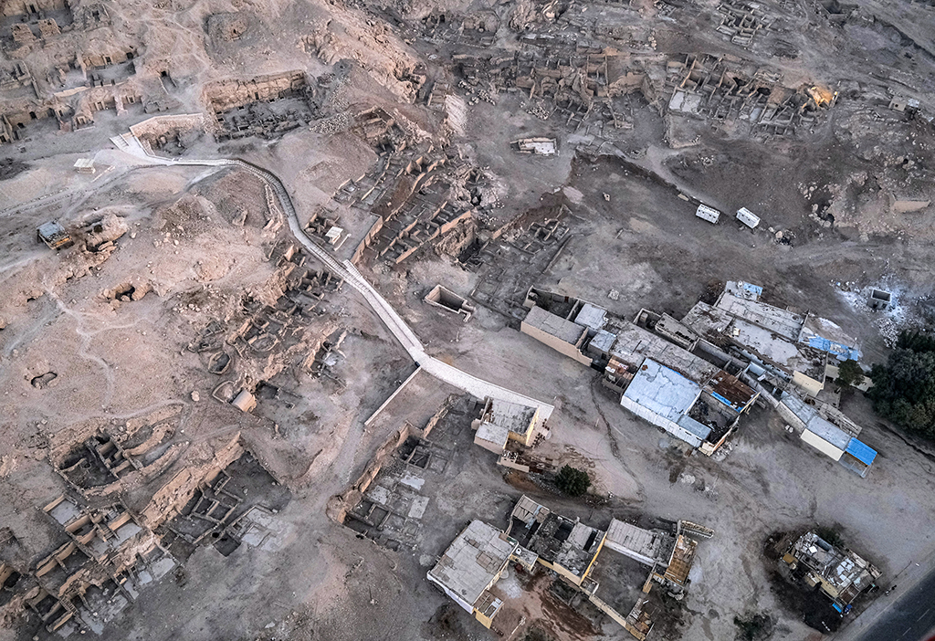 This picture shows an aerial view of abandoned houses in the area known as Qurna (Gurna) which were evacuated in the mid-20th century to allow for archaeological excavations in the Theban Necropolis on the west bank of the Nile river opposite Egypt's southern city of Luxor.