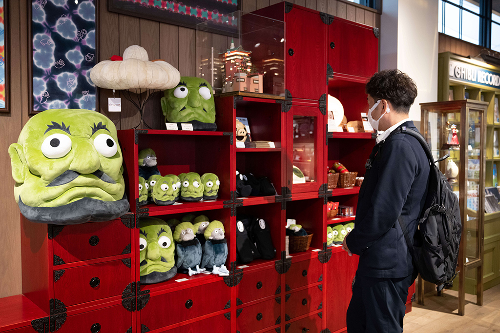A member of the media visits a shop at Ghibli's Grand Warehouse during a media tour of the new Ghibli Park.