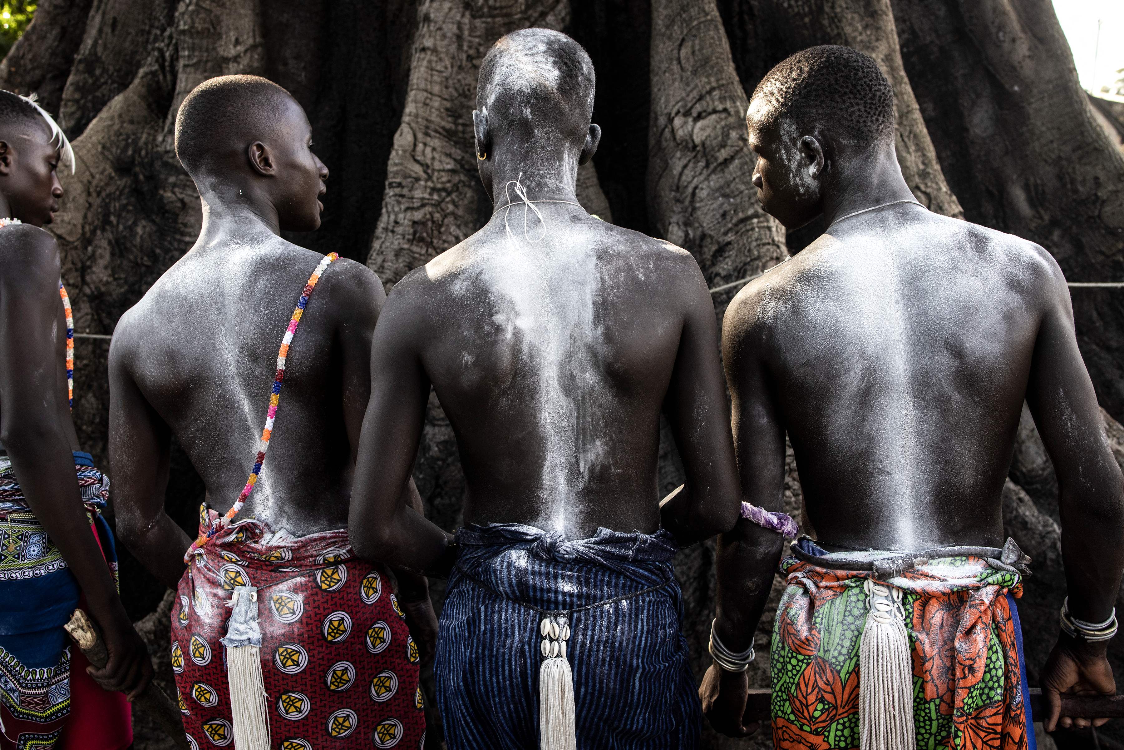 TOPSHOT - Young men, in the early stages of the initiation, attend a ceremony marking the end of the yearly initiation process for young men in Kabrousse, western Casamance, on September 27, 2022. 
