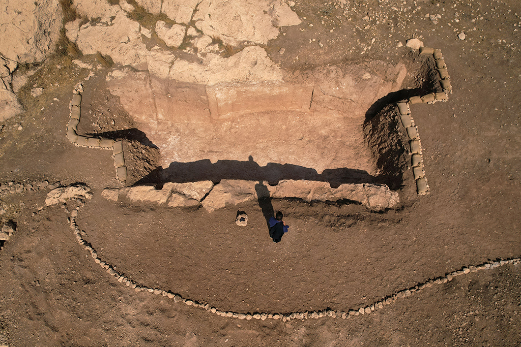 An aerial picture shows a view of a dig revealing an ancient irrigation canal lined with rock carvings dating back to Assyrian times, in the archaeological site of Faydeh (Faida). 