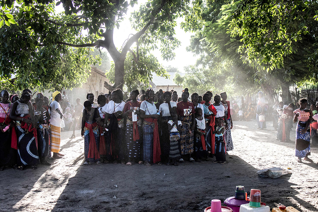 Girls gather to watch the young men's performance during a ceremony marking the end of the yearly initiation process for young men.