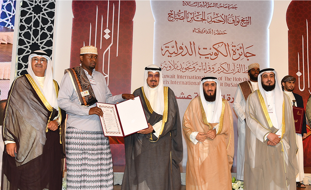 Head of the Crown Prince Diwan, Sheikh Abdullah Al-Ahmad Al-Sabah, honors one of the participants.