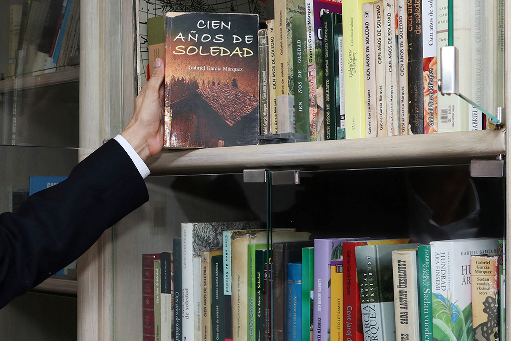 Jorge Salazar holds a Spanish edition of