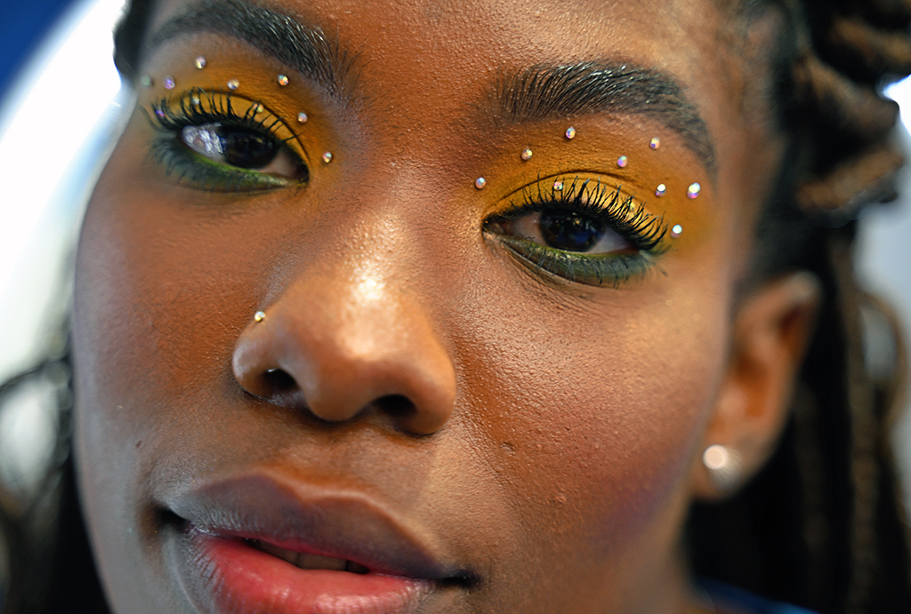 In this file photo Brazilian makeup artist Natalia Bastos poses at her studio with a themed makeup for the FIFA World Cup Qatar 2022 created by her in Ibirite.