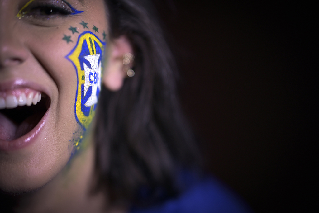 Brazilian makeup artist Natalia Bastos poses at her studio with a themed makeup for the FIFA World Cup Qatar 2022 created by her in Ibirite.