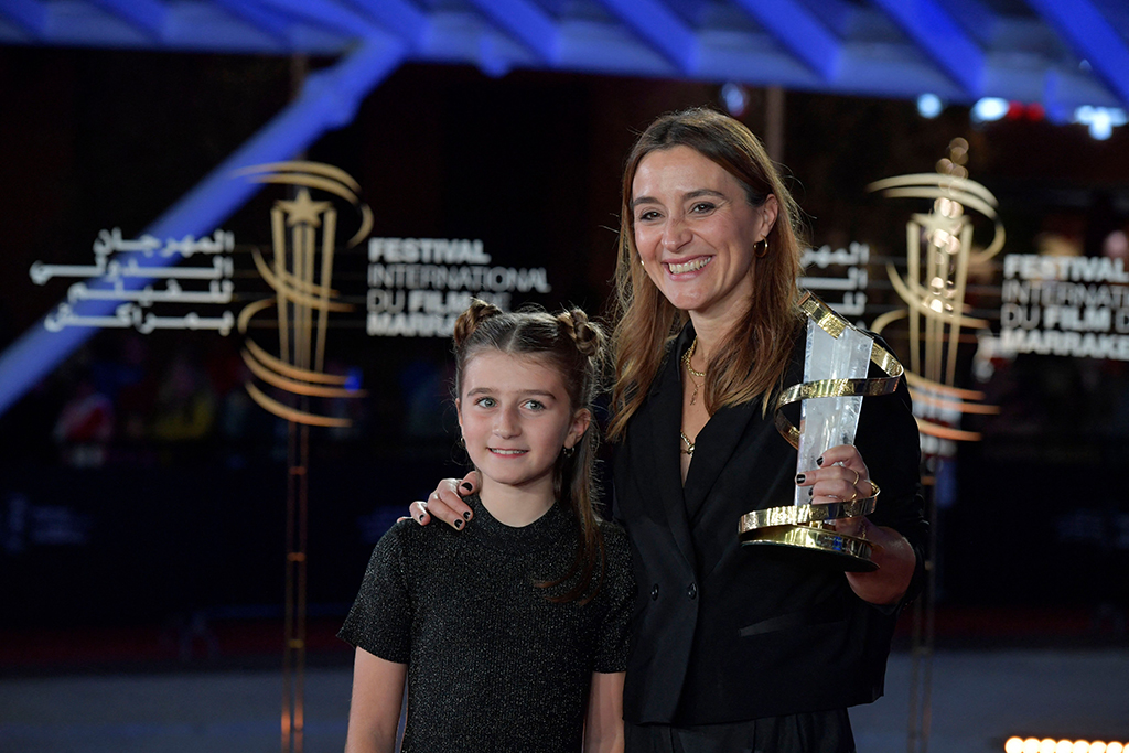Portuguese director Cristele Alves Meira (right) and young actree Lua Michel, pose with the Jury Prize trophy.