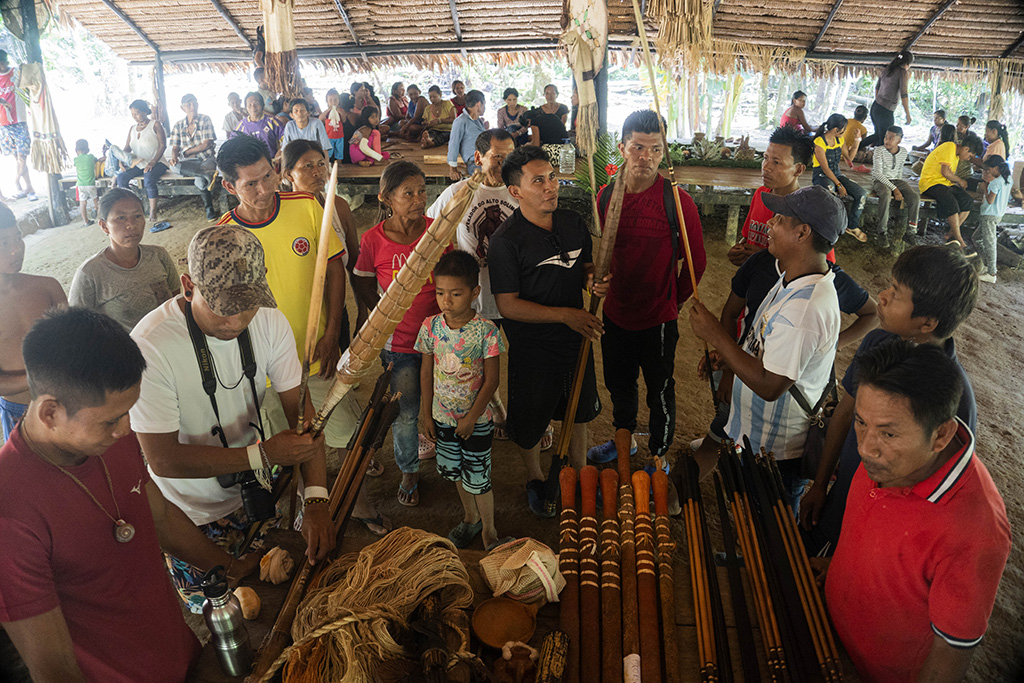 Matis indigenous people show to the Tikuna indigenous people their blowguns, bows, arrows and handicrafts in San Martin de Amacayacu, Colombia.