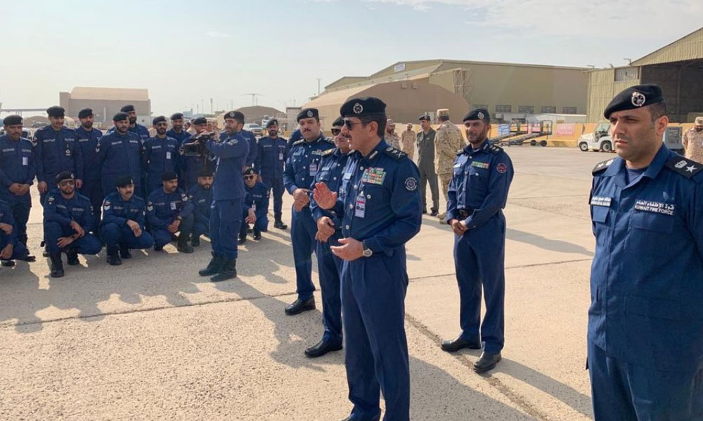 Kuwait's Fire Force (KFF) chief Lieutenant General Khaled Al-Mekrad bids farewell to the Kuwaiti force that would participate in the security plans for Qatar's FIFA 2022 World Cup Finals