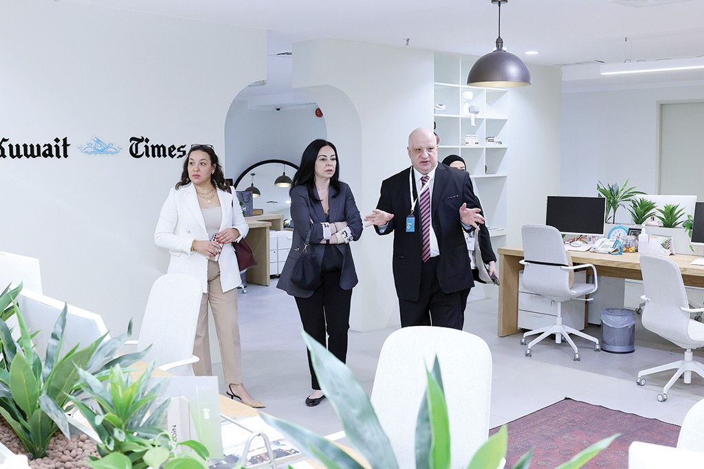 KUWAIT: Mustafa Qamhiya with Margo Helou and Asmae Aitssi at Kuwait Times' editorial office.