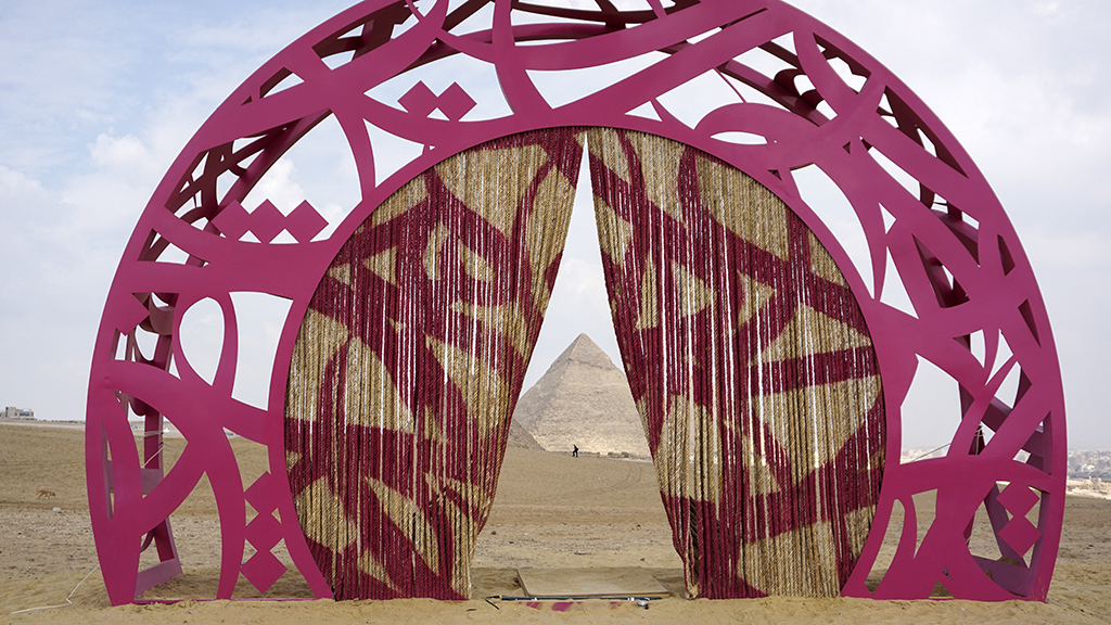This file photo taken on November 4, 2022, shows an installation dubbed “Secrets of Time” by Tunisian artist El Seed at the Giza pyramids necropolis during the second edition of the Art D’Égypte exhibition 