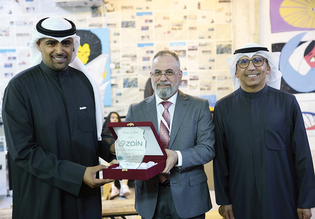 Advertising and Marketing Manager Taleb Kanjo (center) presents a memento to Hamad Al-Musaibeeh, Corporate Relations Department Manager at Zain (left) and Ahmad Jasem Abul Jafar, Sponsorship and Events Professional, External and Internal Relations-Zain Kuwait (right).