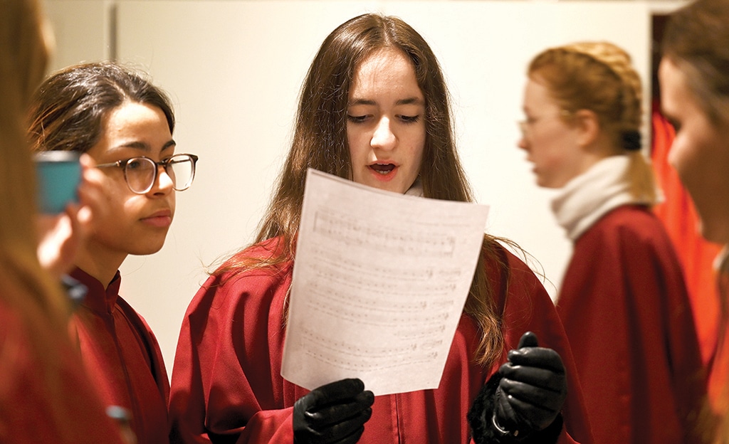 Members of the Regensburger Domspatzen girls' choir prepare for their first appearance during a service at the Regensburg Cathedral.