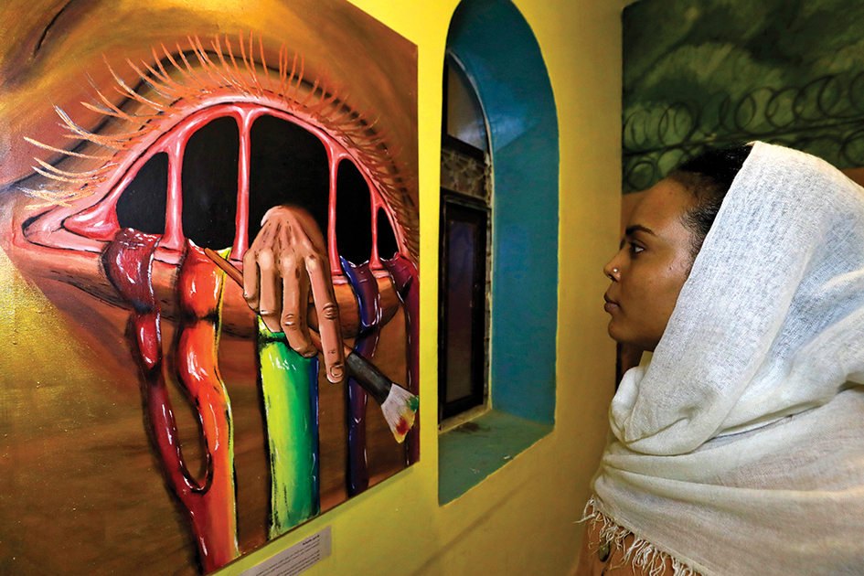 Sudanese visit a Rastafari art exhibition in Sudan's capital Khartoum.