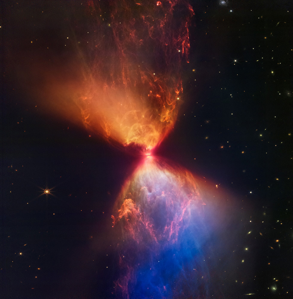 In this file photo taken by Nasa from the NASA/ESA/CSA James Webb Space Telescope's Near-Infrared Camera (NIRCam) instrument shows the protostar within the dark cloud L1527 embedded within a cloud of material feeding its growth. 