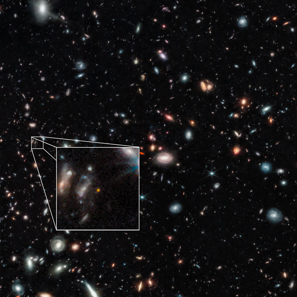 This file handout photo from NASA's James Webb Space Telescope Near-Infrared Camera (NIRCam) released by NASA and STScl shows one of two farthest galaxies seen to date of the outer regions of the giant galaxy cluster Abell 2744.