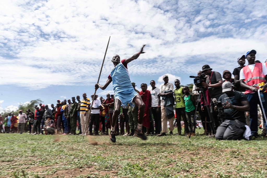A participant from Kuku village throws a spear during the Maasai Olympics.