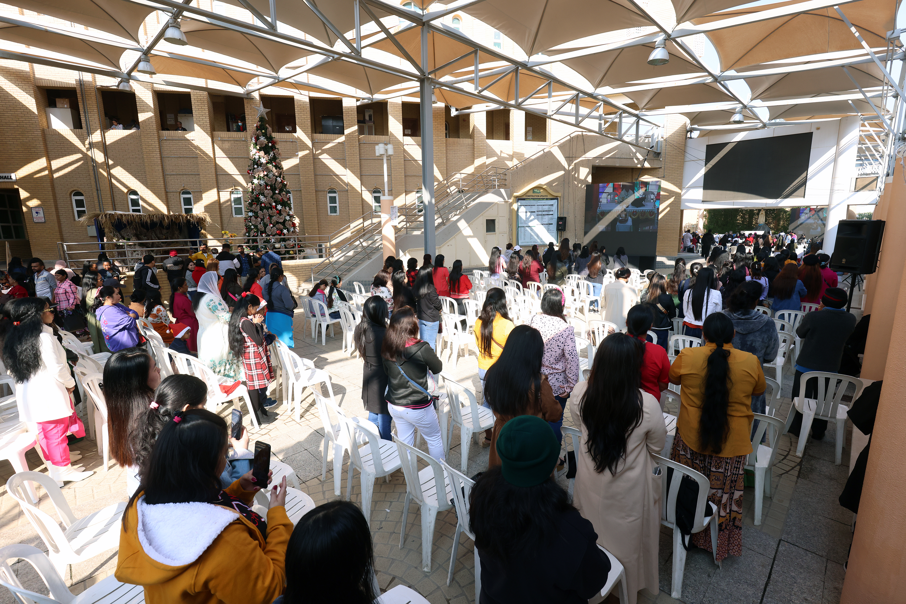 Christian worshippers attend a Christmas morning service at the Catholic’s Holy  Family Church in Kuwait City on December 25, 2022.