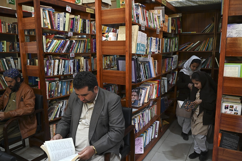 People read books inside the Darra Adam Khel Library in Darra Adamkhel town.