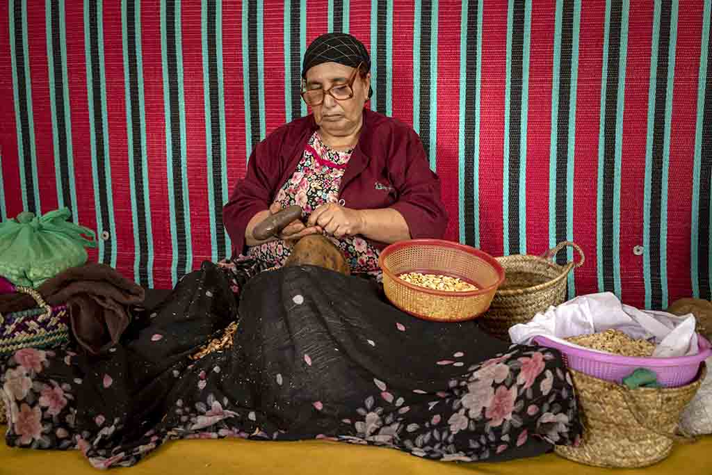 A woman shells Argan nuts to make oil near Morocco's western Atlantic coastal city of Essaouira.