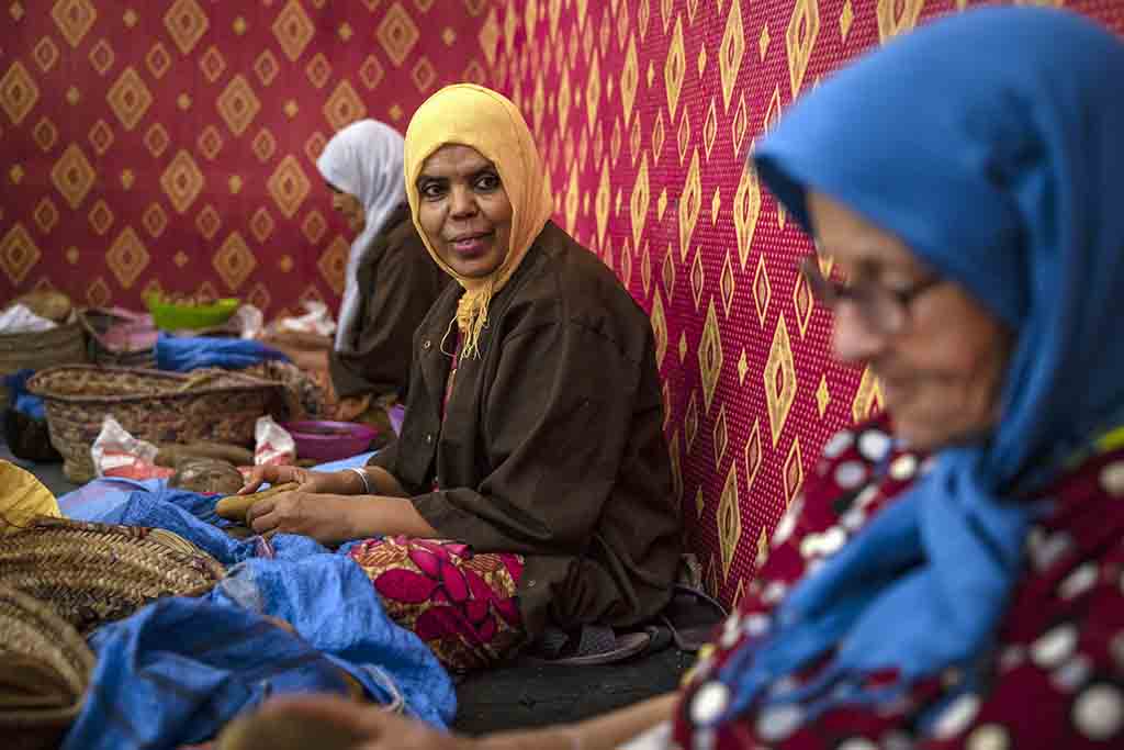 Women shell Argan nuts to make oil near Morocco's western Atlantic coastal city of Essaouira.