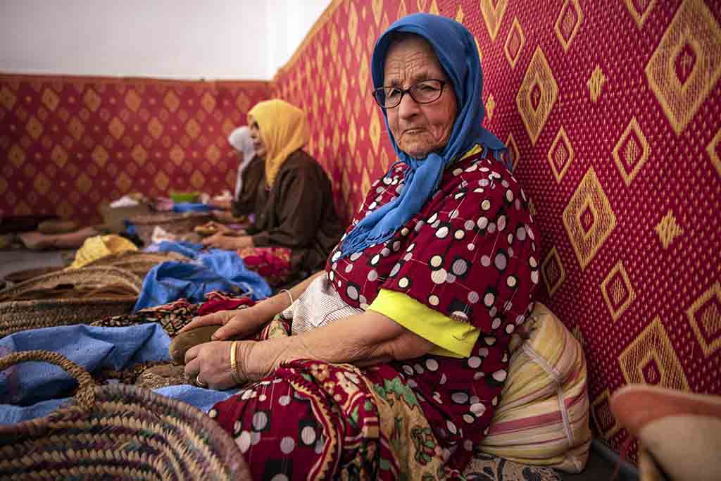 Women shell Argan nuts to make oil near Morocco's western Atlantic coastal city of Essaouira.