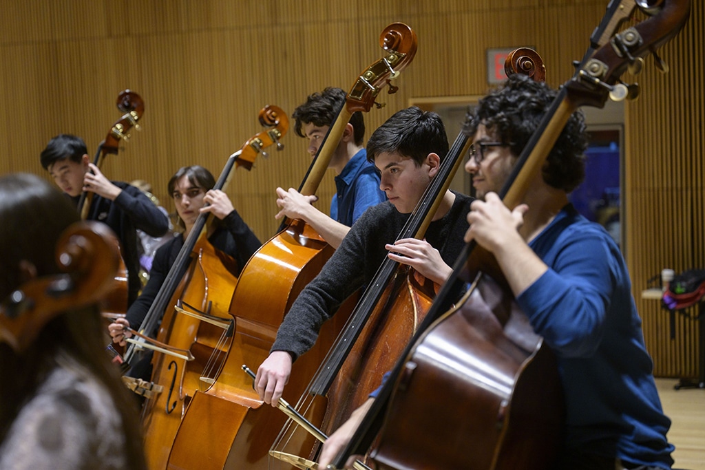 Young bass players with the New York Youth Symphony perform during a rehearsal in New York City. 