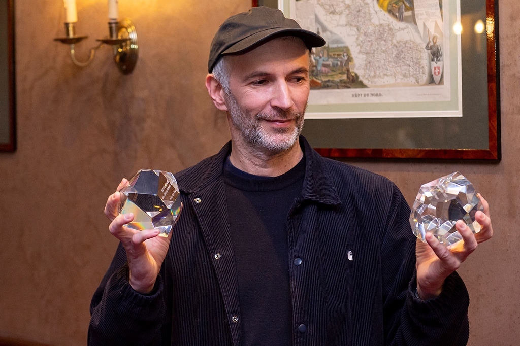French director Thomas Salvador poses with his Critics Award and Jury Prize trophies for his film 