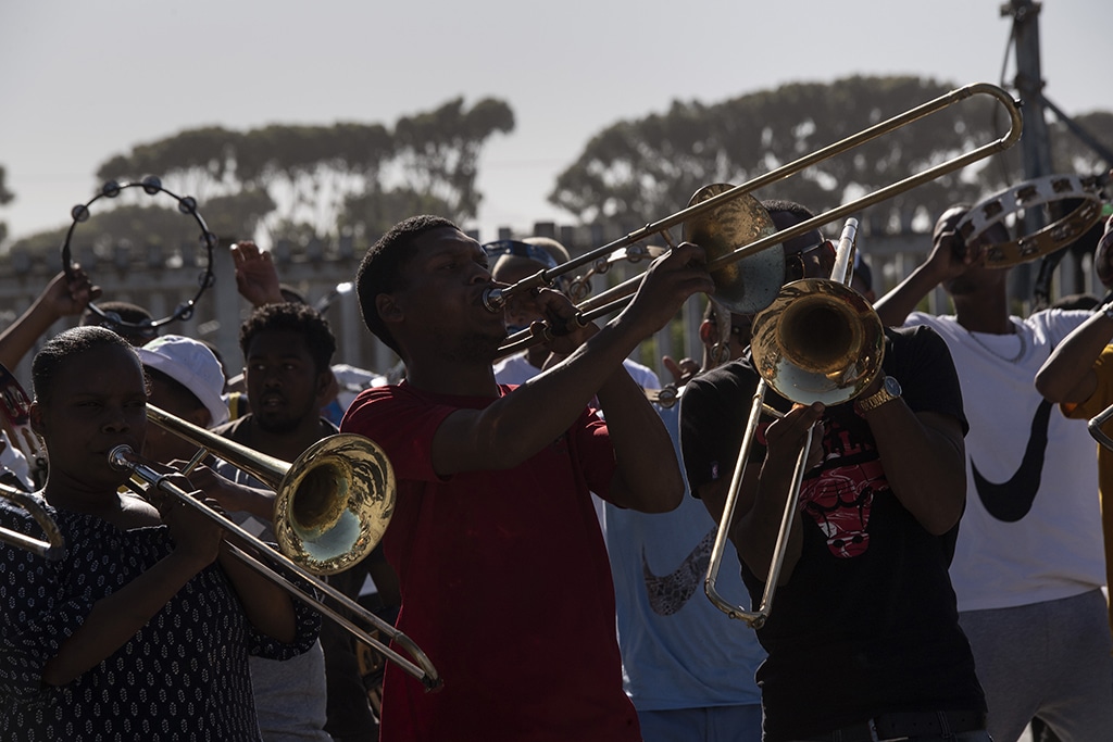 Members of the Playaz Inc minstrel troupe sing and dance as they practice at a school in Mitchells Plain near Cape Town.