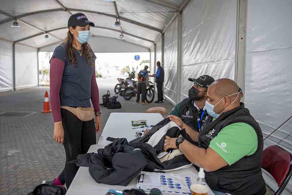 This file handout picture provided by the Sharqiyah International Baja Toyota shows Saudi rider Dania Akeel, the first ever Saudi female to tackle an international rally, talking to event staff in Saudi Arabia.