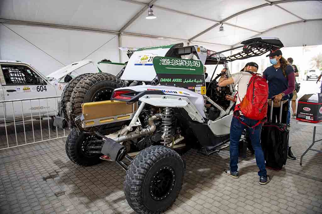 This file handout picture provided by the Sharqiyah International Baja Toyota shows Saudi rider Dania Akeel, the first ever Saudi female to tackle an international rally, standing next to her vehicle in Saudi Arabia.