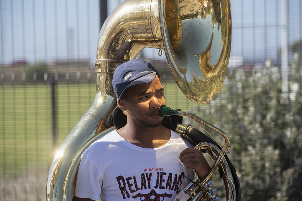 A member of the Playaz Inc. minstrel troupe gets ready to play his tuba. 