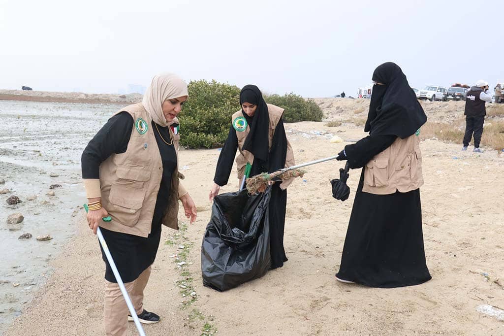 Volunteers clean the beach in Sulaibikhat.