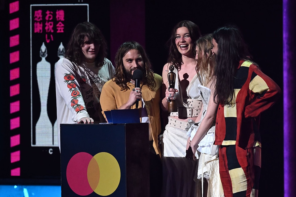 British indie rock band Wet Leg celebrates after receiving the group of the year award.