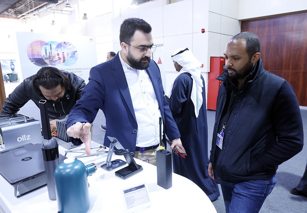 Zain's staff explaining a product for a customer.