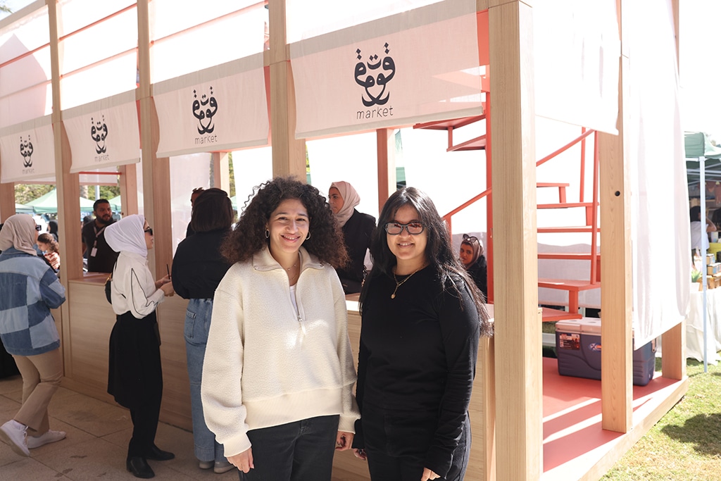 Co-founders of Qout Market Bedoor Al-Qassar (left) poses for a photo with Nouf Hussain.