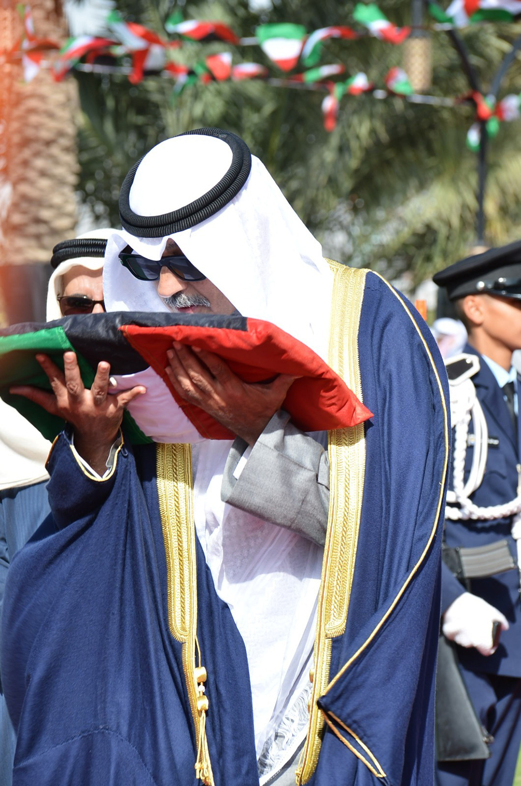 Ahmadi Governor with the national flag