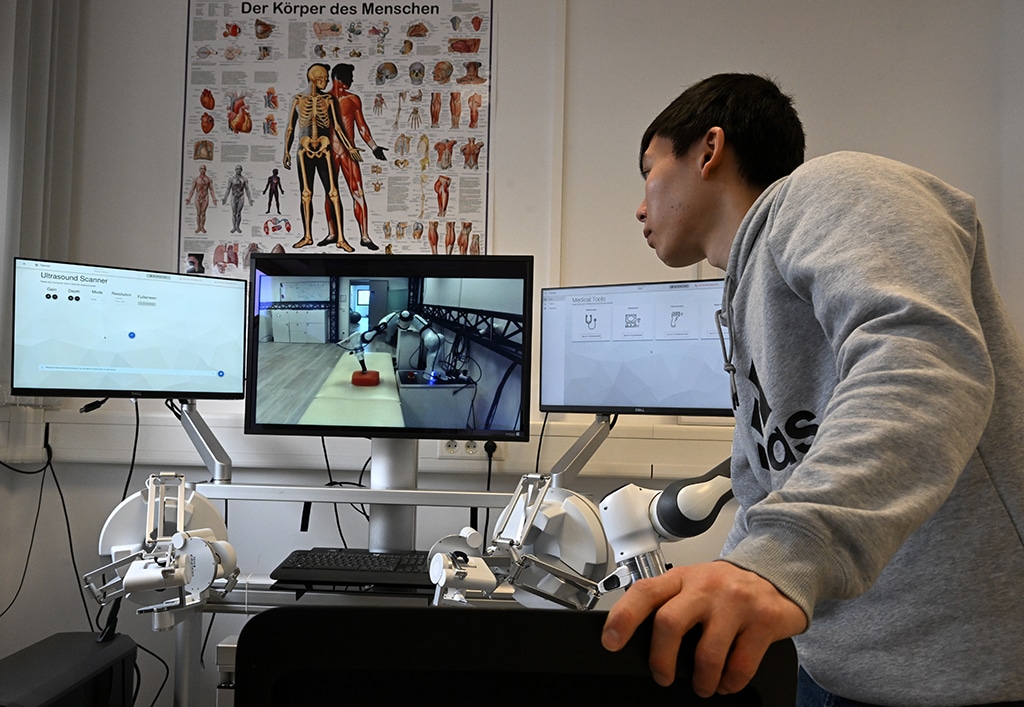 An employee works at a doctor's workplace for remote diagnosis.