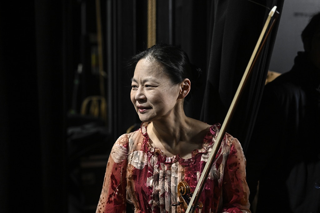 Japanese-born American violinist Midori Goto watches from backstage the music students from the National Institute of Music of Afghanistan (Anim) performing onstage.