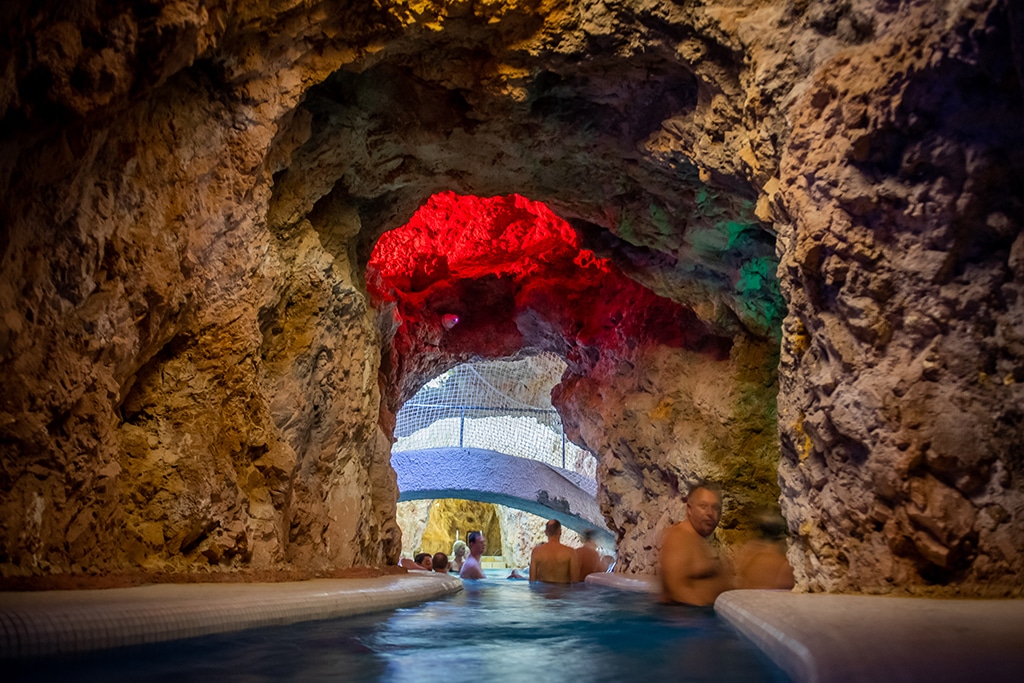Tourists and guests swim in the hot water of a Cave Spa in Miskolctapolca, an unique labyrinthine cave complex located 185 kms far from Budapest.