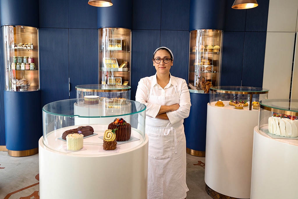 Iranian pastry chef Shahrzad Shokouhivand, poses for a picture inside her luxury pastry shop in Tehran.