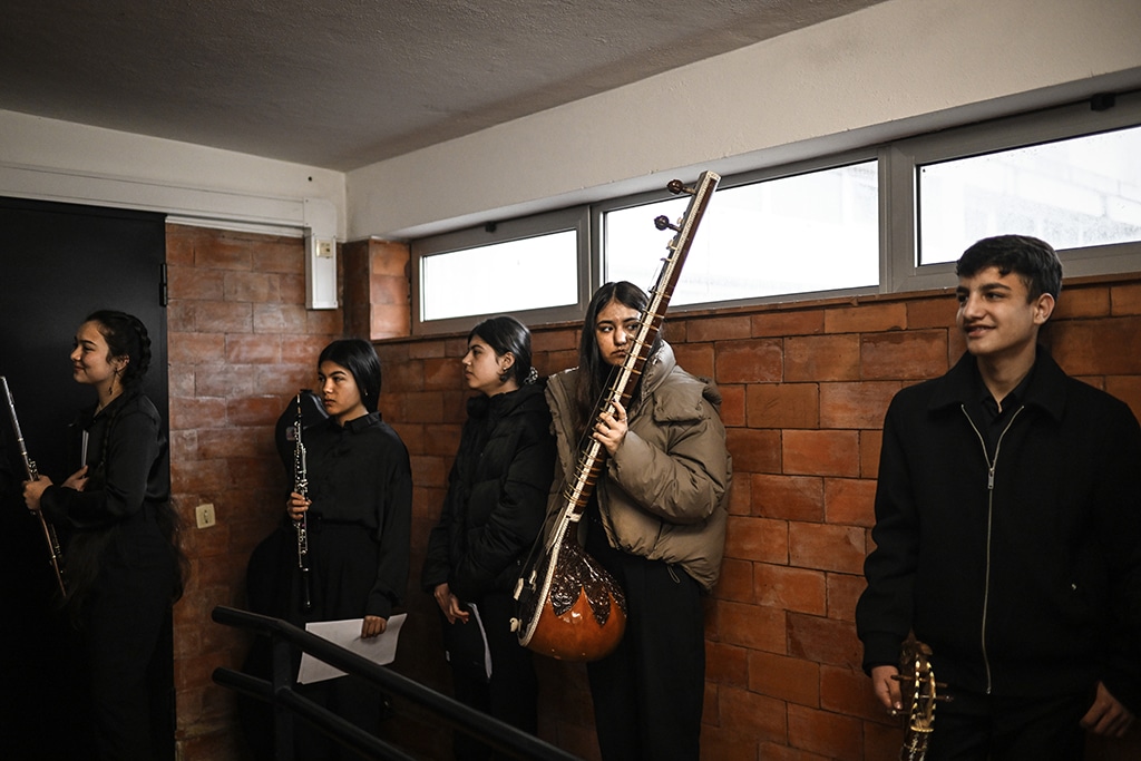 Music students of the National Institute of Music of Afghanistan (Anim) hold their instruments at the backstage prior to a concert at the Music Conservatory of Braga, north of Portugal.