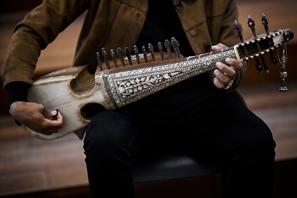 Ramiz, 19 years old, music student from the National Institute of Music of Afghanistan (Anim), plays Afghan instrument called rubab.
