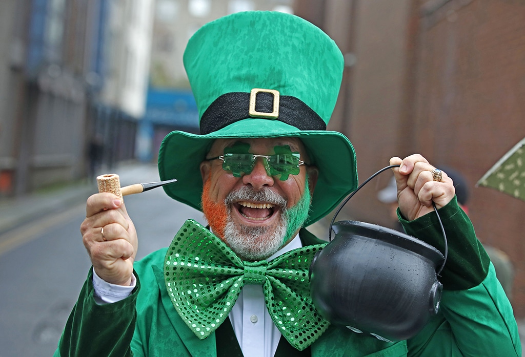A participant poses for a photograph while attending the annual St Patrick's Day parade in Dublin.