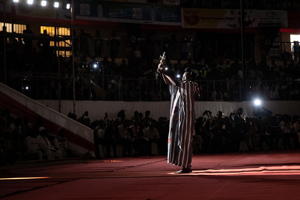 A woman brings on stage the Etalon d'Or, the most prestigious award of the festival, during the closing ceremony of the 28th Pan-African Film and television Festival (FESPACO).