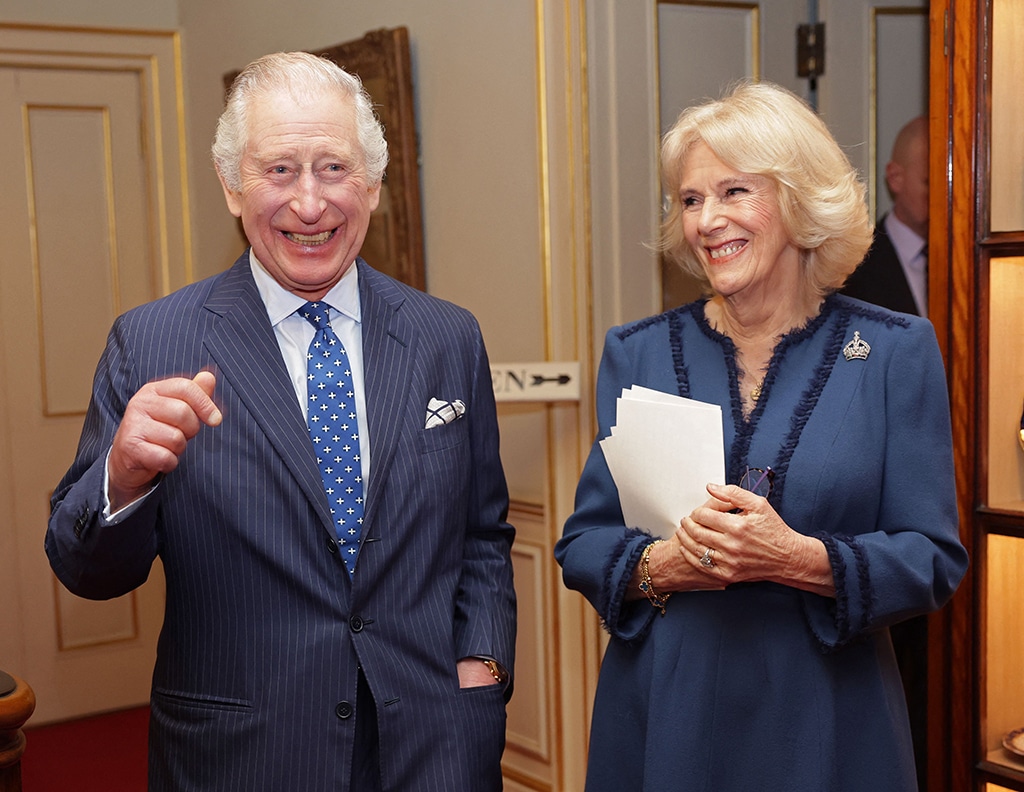 In this file photo taken on February 23, 2023 Britain's Camilla, Queen Consort (right) and Britain's King Charles III (left) share a joke at a reception at Clarence House in London.