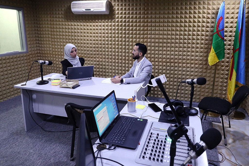 In this picture teacher Assirem Shuwashia (left) and architect Ismail Abudib (right), present a radio program in Tamazight language at Kasas FM in Zuwara, a majority-Berber community near the border with Tunisia.