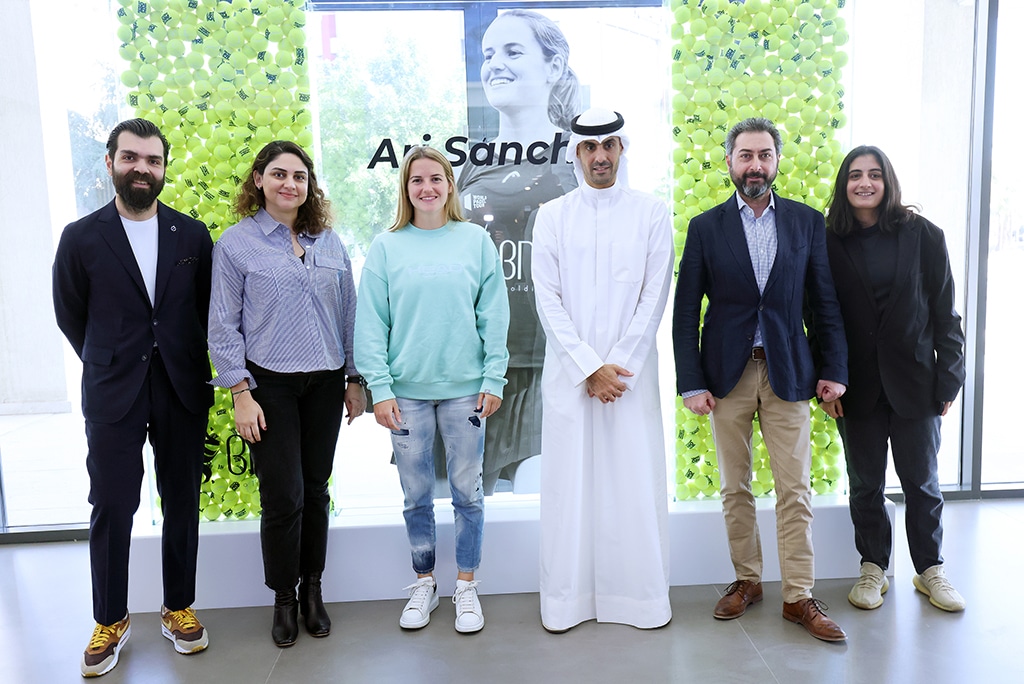 Bader Al-Kharafi (center) takes a group photo with Volvo team.