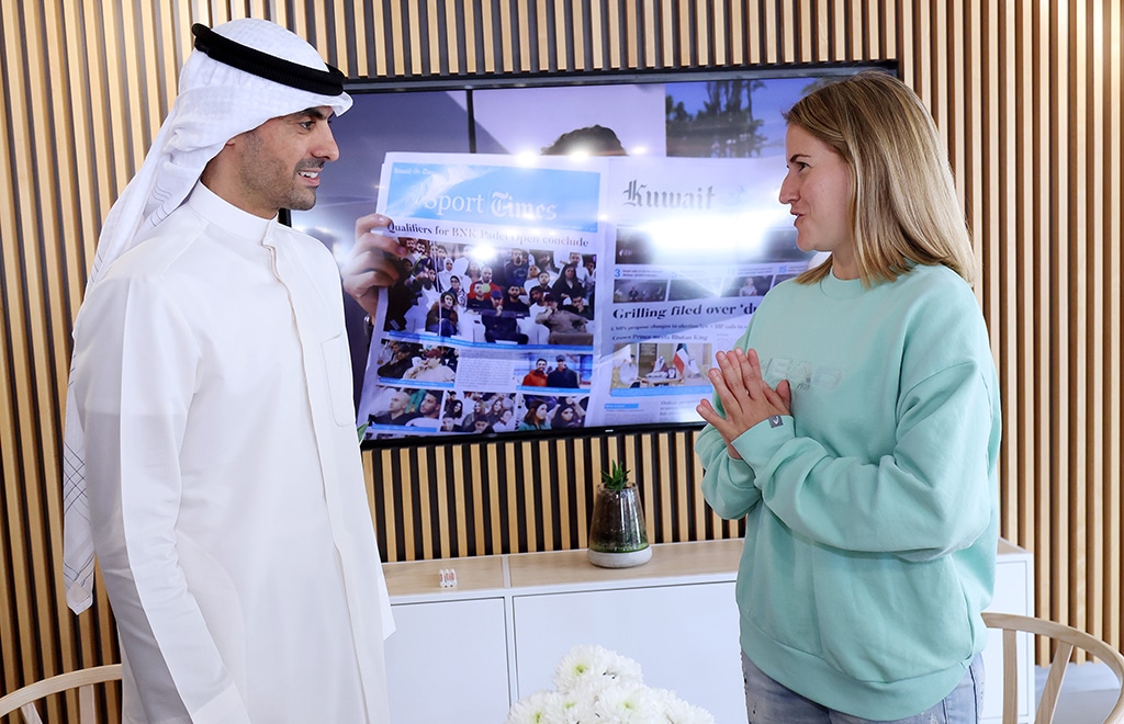 Bader Al-Kharafi chats with Ari Sanchez after signing the sponsorship deal.