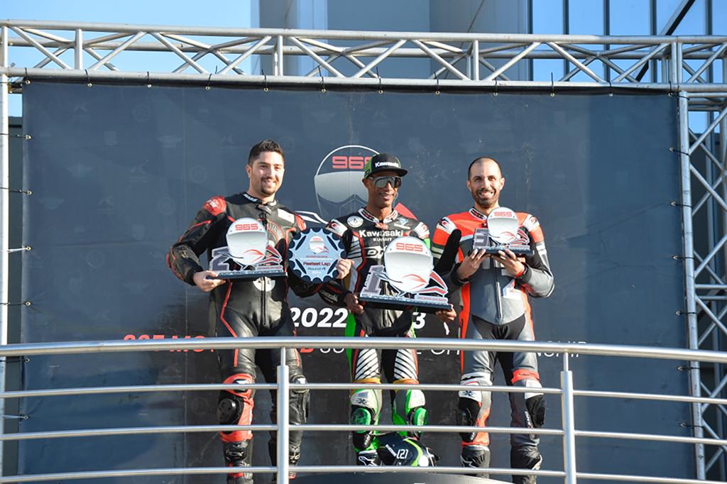 Winner of the Race 600cc Mohammed Al-Zaidan (center) poses with Ali Boushehri (second position) and third place winner Mustafa Husain (right).